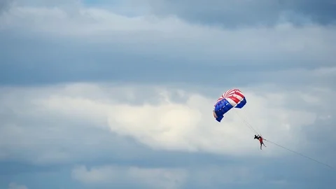 Close up of parachuting or parasailing with blue sky background. Stockbeeldmateriaal 83635046
