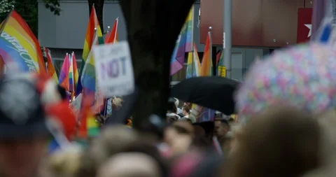 Close Up of Parading Through The Streets With Rainbow Flags For Gay Rights  Stock Footage 113516093