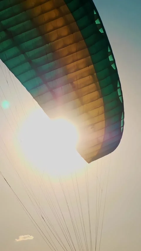 Close-up of a paraglider parachute fluttering in the wind, against a background Video stock 321013313