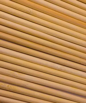 Close up of parallel bamboo sticks creating linear natural texture background Stock Photos
