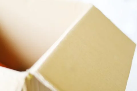 Close up of parcel post / open cardboard box Stockfoto's