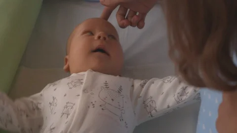 Close Up Parent holding and touch Newborn baby 스톡 동영상 89975675