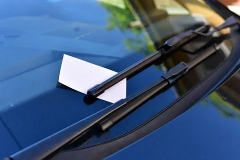 Close up of parking fine on car windscreen. Stock Photos