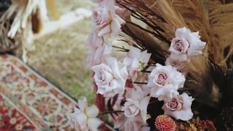 Close-up of part of beautiful boho arch decoration on outdoor wedding ceremony Stock Footage 227882022