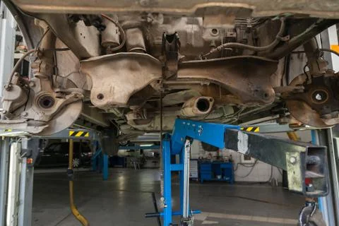 Close-up on the part of the car bottom from the front of the exhaust pipe, en Stock Photos