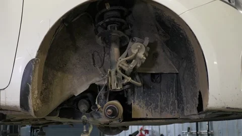 A close-up of a part of the car with a completely disassembled wheel. Stock Footage 297839177