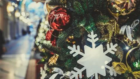 Close up of part of Christmas tree with different christmas toys and garland  Stock Photos
