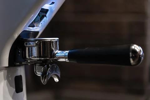 Close-up part of a coffee machine, a holder for coffee. Stock Photos