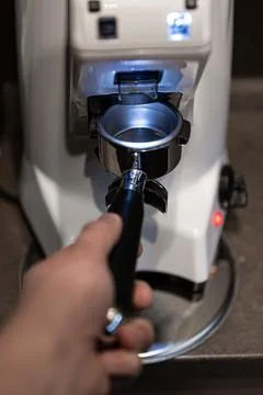 Close-up part of a coffee machine, a holder for coffee. Stock Photos