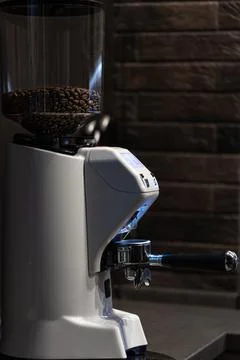Close-up part of a coffee machine, a holder for coffee. Stock Photos