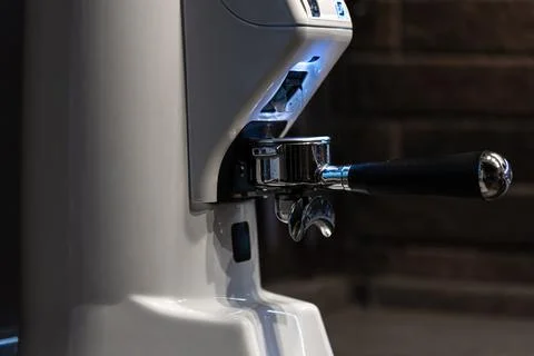 Close-up part of a coffee machine, a holder for coffee. Stock Photos