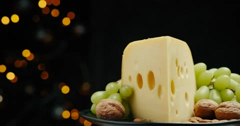 Close up part of Medium hard cheese head edam gouda parmesan on wooden board Video stock 146397643
