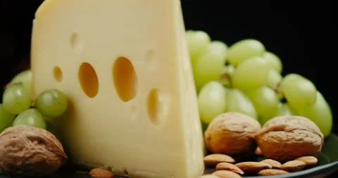 Close up part of Medium hard cheese head edam gouda parmesan on wooden board Video stock 146397942