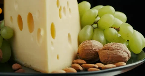 Close up part of Medium hard cheese head edam gouda parmesan on wooden board Video stock 146783025