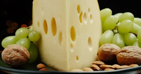 Close up part of Medium hard cheese head edam gouda parmesan on wooden board Video stock 146783417