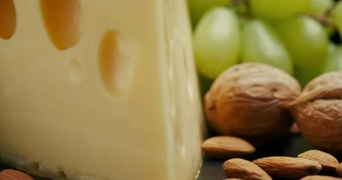 Close up part of Medium hard cheese head edam gouda parmesan on wooden board Video stock 146984883