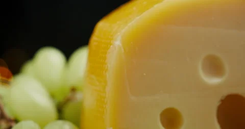 Close up part of Medium hard cheese head edam gouda parmesan on wooden board Video stock 146985230