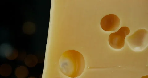 Close up part of Medium hard cheese head edam gouda parmesan on wooden board Video stock 146985826