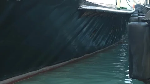 Close up of part of moored passenger ship. bow of ship with rope near shore with Stock Footage 280229715