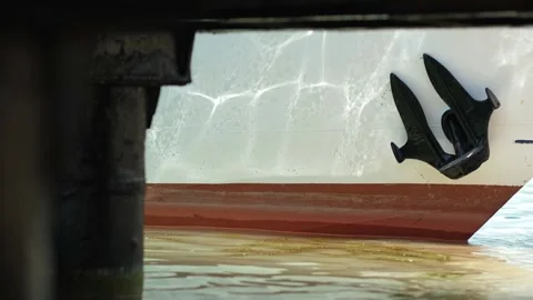 Close up of part of moored passenger ship. bow of ship with rope near shore with Stock Footage 280229870