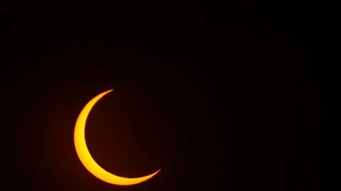 Close up of partial solar eclipse while sun is moving on the sky. Some are se Stock Footage 122129769