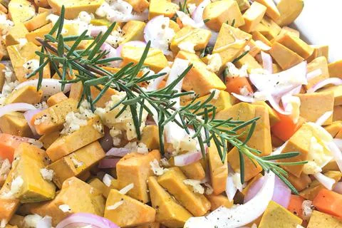Close-up partial view of preparing ingredients for pumpkin soup. Stock Photos