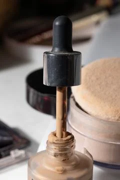 Close-up of a partially used liquid foundation with dropper, showing residue  Stock-Fotos