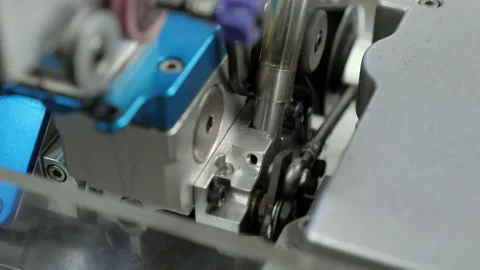 Close-up parts of the machine with threads, Production process in garment Stock Footage 197433343