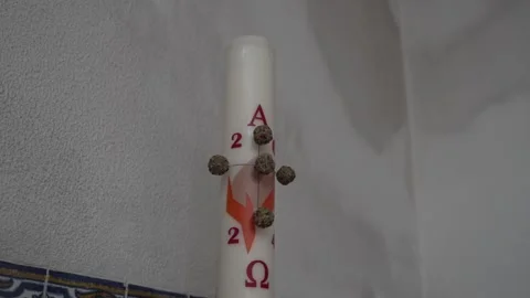 Close-up of a Paschal candle adorned with symbolic elements against a Stock Footage 278023650