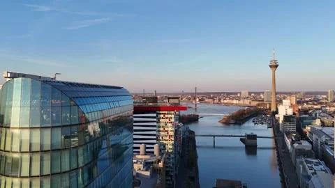 Close pass across reflective facade and tower skyline Stock Footage 331196869
