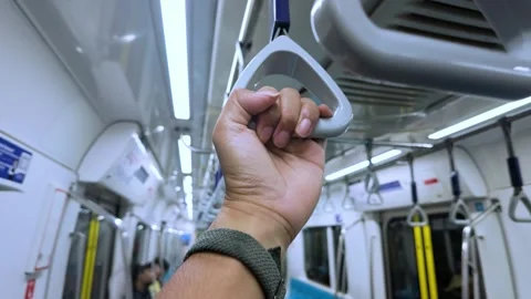 Close Up Of Passenger Hand Holding Hanging Strap Inside Train Car Video stock 338387866