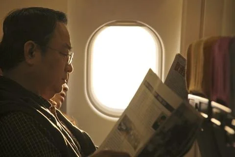 Close up of passengers in the cabin of plane. Stock Photos