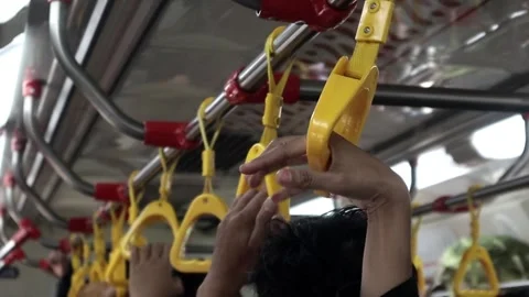 Close up of passenger's hand grip inside the train, commuter line,  Stock Footage 289602390