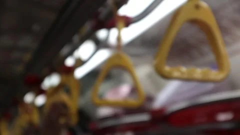 Close up of passenger's hand grip inside the train, commuter line, indonesian ra Stock Footage 289602465
