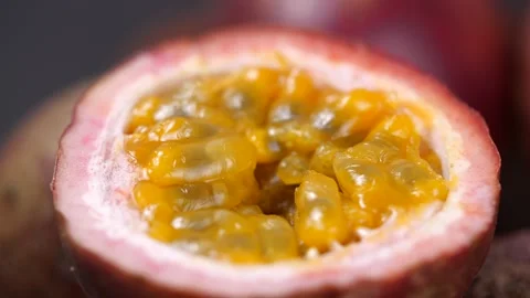 Close-up of Passion fruit rotate in slow motion. Exotic fruit for healthy eating Stock Footage 142774843