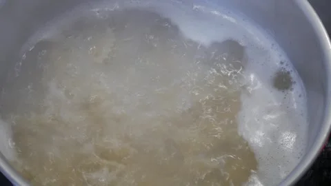 Close-Up of Pasta Boiling in Pot with Bubbling Water - Cooking Process Stock Footage 328942369