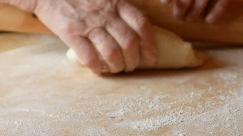 Close up on pasta that is rolled out with a rolling pin Stock Footage 84193855
