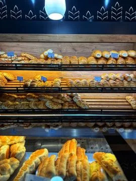 Close-Up of Pastries in Bakery Showcase 写真素材