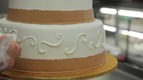 Close-Up of Pastry Chef Adding Decorations to Elegant Wedding Cake Stock Footage 231414259