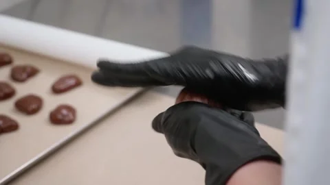 Close-up of Pastry Chef in Black Gloves Shaping Chocolate Dough Balls for Desser Stock Footage 337751635