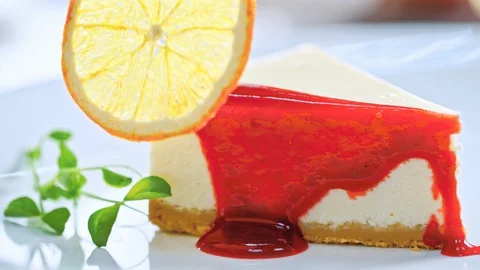 Close-up of the pastry chef decorating a cake with red jam before serving Stock Footage 85591384