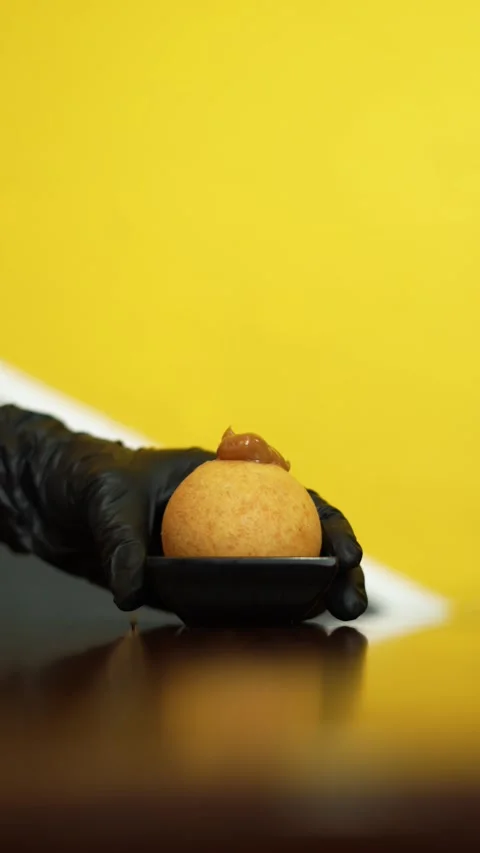 Close-Up Pastry Chef Placing a Cheese Bun Filled with with Sweet Caramel Sau Stock Footage 286168755