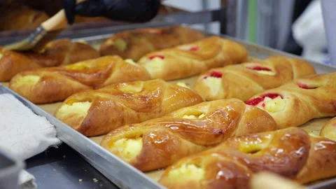 Close-up of a pastry chef preparing sweet rolls with cottage cheese and jam. Stock Footage 339787026