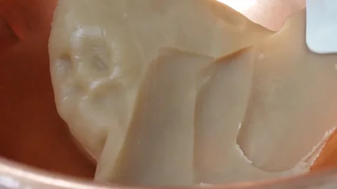 Close-up of Pastry Chef Scraping Thick Dough with Spatula in Copper Pot Stock-Footage 345293416