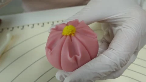 Close-Up of Pastry Chef Sculpting Pink Nerikiri Wagashi with Tweezers Stock Footage 345293548