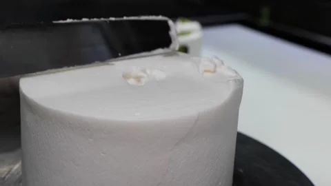 Close-up of Pastry Chef Smoothing White Whipped Cream Frosting on Round Cake Stock Footage 331777433