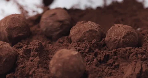 Close-up of a pastry chef's hand making handmade organic chocolate truffles Stock Footage 165806207