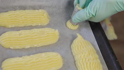 Close-up, Pastry Hands in Gloves Squeezed Out of Test Balance Package for Eclair Stock Footage 136881461