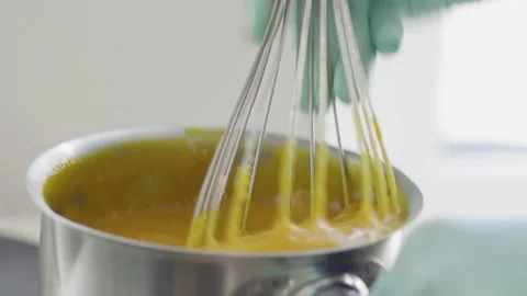 Close-up, Pastry Hands in Gloves Stir Cake Cream With Metal Whisk Stock Footage 136261663