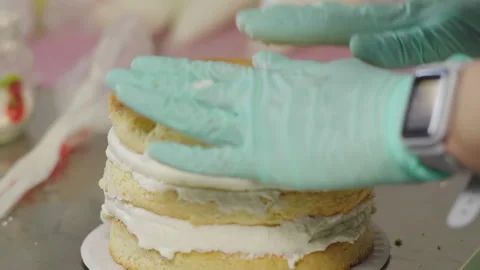 Close-up, Pastry Puts Cake Cake On Top of Fruit Filling Stock Footage 140058040